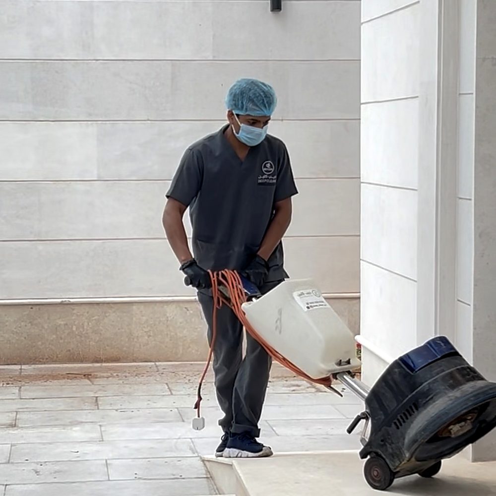 Scrubbing building forecourt floors